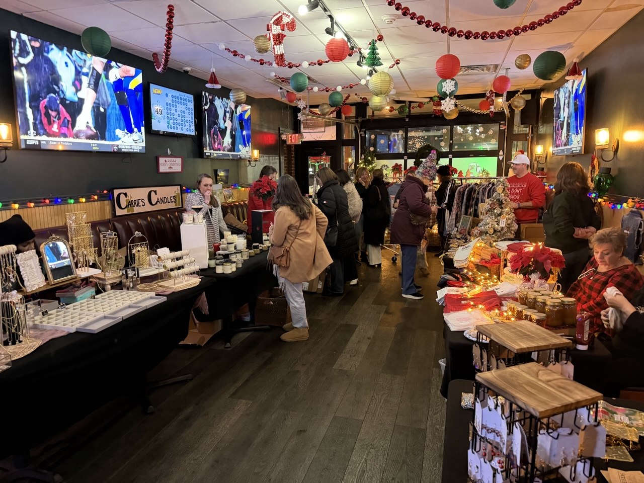 Holiday market set up inside the bar with candles, jewelry and local makers